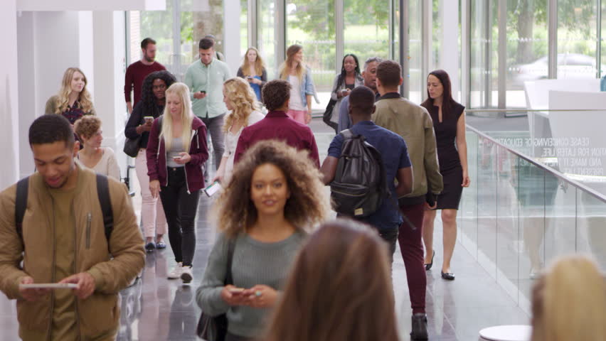 Students and teachers walk in foyer of a modern university, shot on R3D Royalty-Free Stock Footage #21195955
