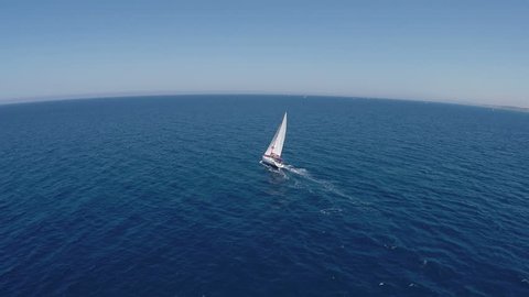 Sailing yachts with white sails in the open Sea. Drone view 