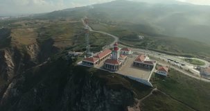 Cabo da Roca light house aerial video. Epic aerial footage of lighthouse standing on the edge of the cliff, Cape Roca, Portugal. Western point of Europe. Freedom, power concept.
