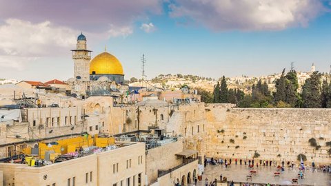 View to Western Wall known at the Wailing Wall or Kotel in Jerusalem is a major Jewish sacred place, Old city and the Temple Mount, Dome of the Rock and Al Aqsa Mosque - Time Lapse, Pan Right