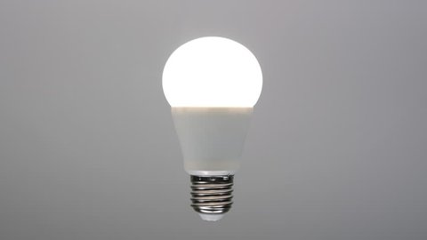 Led bulb turning on, energy saving lamp with e27 socket