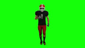 Player is running in a red helmet with the ball in his hands. Front view. Green screen - Powered by Shutterstock - Get 15% off with code: PIKWIZARD15