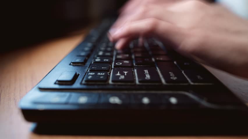 Close-up of male hands typing on black keyboard	 | Shutterstock HD Video #21221335