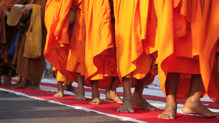 BANGKOK, MARCH 25, 2012: Monks are participating in a Mass Alms Giving of 12,600