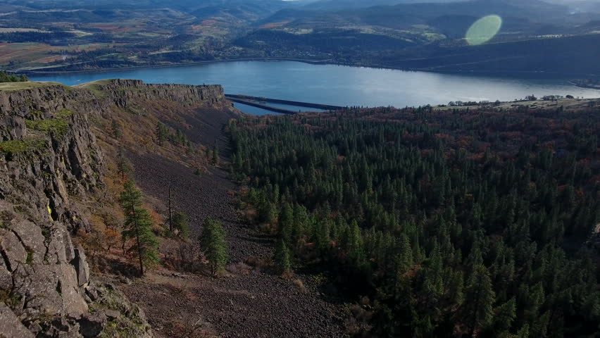 Aerial of father and son, taking in the beauty of the Columbia River Gorge at the top of Syncline.
