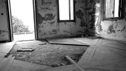 4K Room of of abandoned house without door and windows, black and white image
