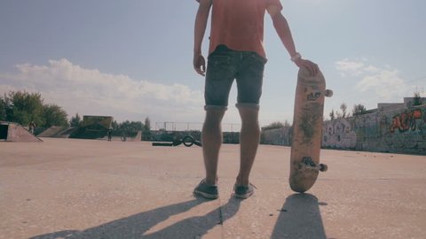 Skateboard fails. Skateboarder skateboarding and falling down doing tricks in a street. Slow motion.