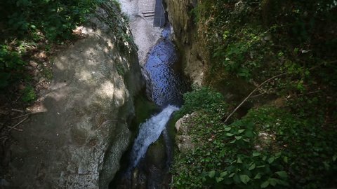 Waterfall in a forest of Molina, Italy