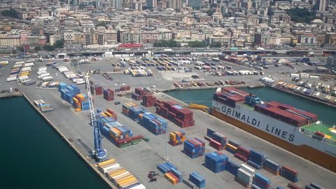 GENOA, ITALY - JULY 20, 2016: Lot of freight containers in the port of the city from the airplane window. Genoa - the main city of the province of Genoa and the Liguria region
