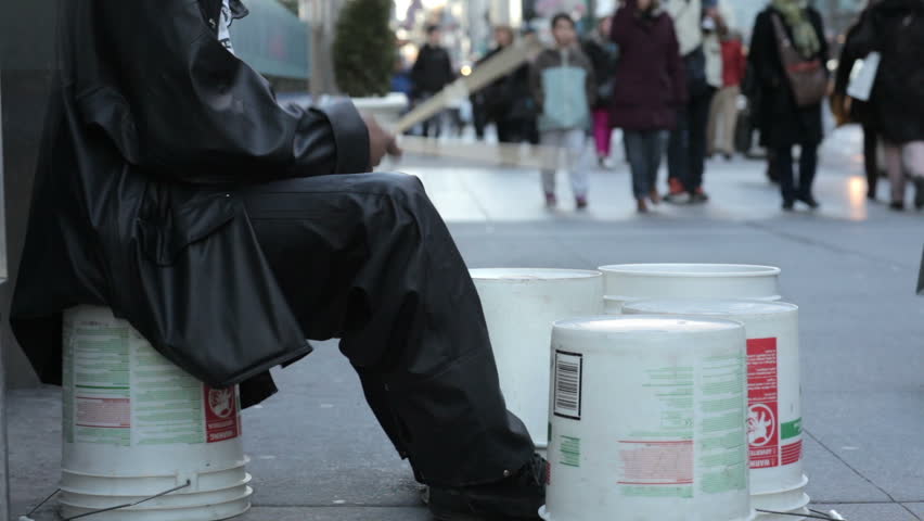Street Performer Drumming Buckets