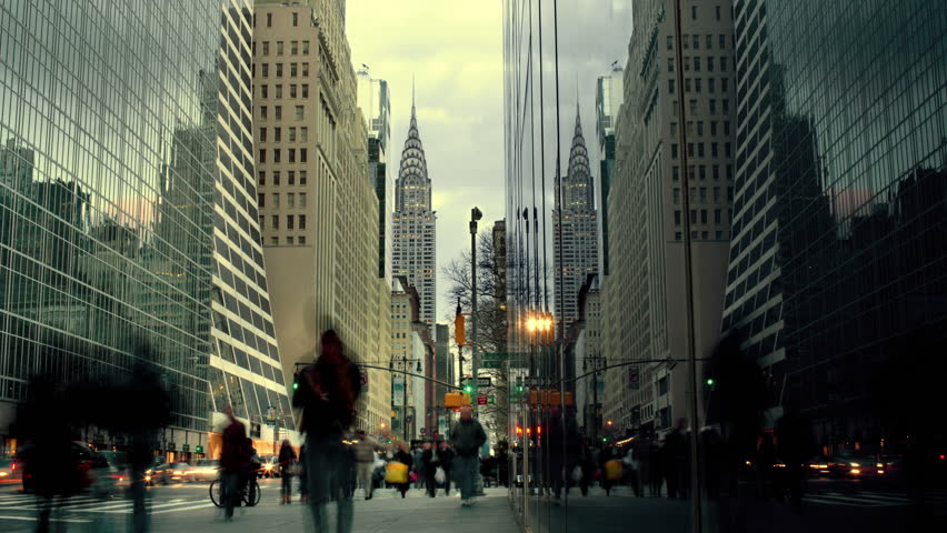 Timelapse People walking on Busy, Crowded street in Midtown Manhattan New York City, with Chrysler Building in Background, Day to Night, NYC, USA