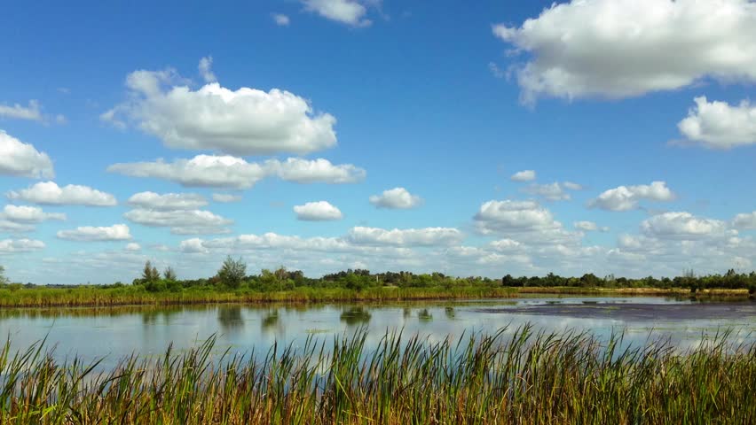 Timelapse of Clouds and Blue Sky at the Lake.