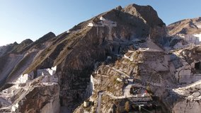 Aerial shot, the worlds famous Carrara marble caves with the soft sunset light, filmed with drone