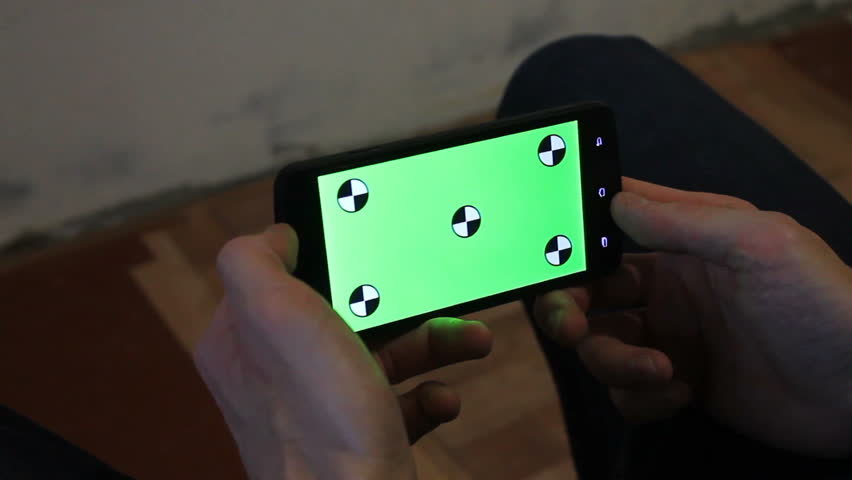 A young man and a green screen smartphone | Shutterstock HD Video #21246580