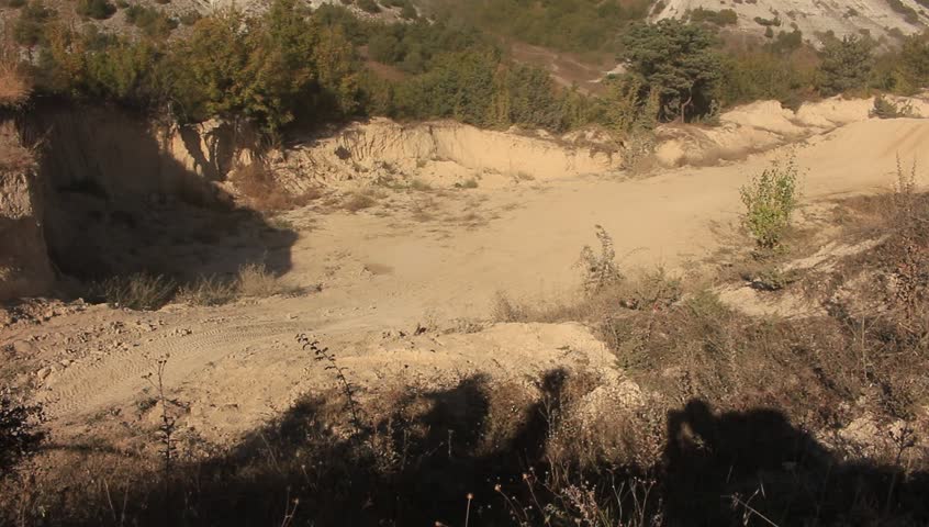 Moto Cross Bikers are Jumping over Hill at the Competition