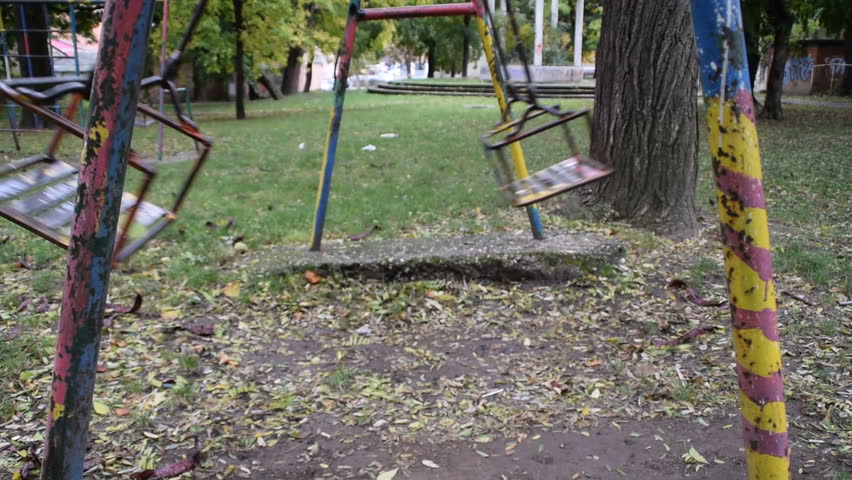  swinging empty swings in the park  Royalty-Free Stock Footage #21252289