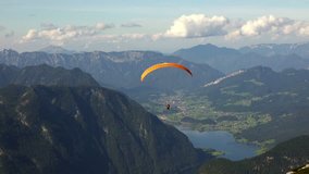 Skydiver or Paraglider over Austrian Alps Mountains. 4K Ultra HD 3840x2160 Video Clip