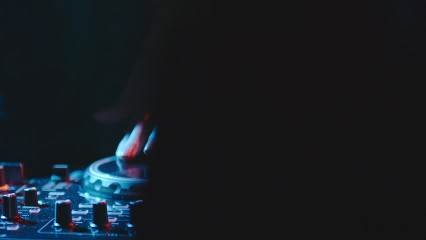 Close up of female hands turning knobs on professional DJ mixer console | Shutterstock HD Video #21260215