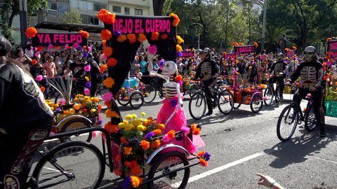 MEXICO CITY, MEXICO - OCTOBER 29, 2016: Day of the Dead Parade Bikers With Flower Baskets