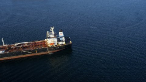 Aerial view of commercial oil container tanker ocean moored, USA