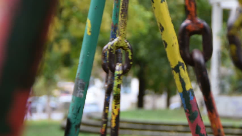 dilapidated swings swinging in the park  Royalty-Free Stock Footage #21269650