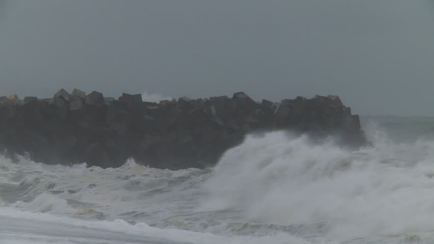 Storm driven waves crash into a ports breakwater.