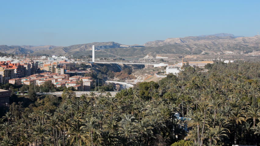 Cityscape of Elche, Spain with one of its date palm groves. The Palmeral of Elche is listed as UNESCO World Heritage site