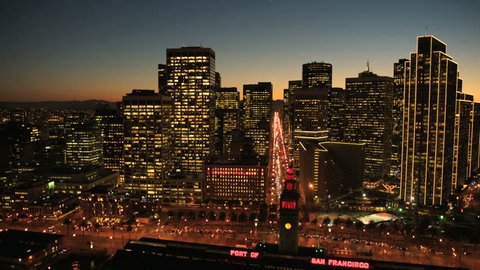 Aerial sunset low angled illuminated street view with San Francisco city skyscrapers, North America, USA