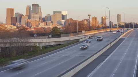 Expressway Traffic of Minneapolis as the Sun Sets Casting Shadows over Downtown 4K UHD Timelapse