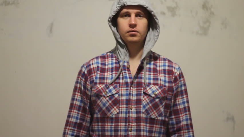 young man on white background shatters into particles