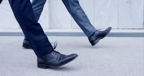 Slow-Mo Close-Up On Feet Of Two Business Men Walking In Traditional Custom