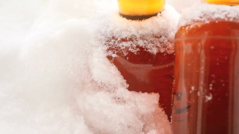 Beer left outside in snowy cold weather.