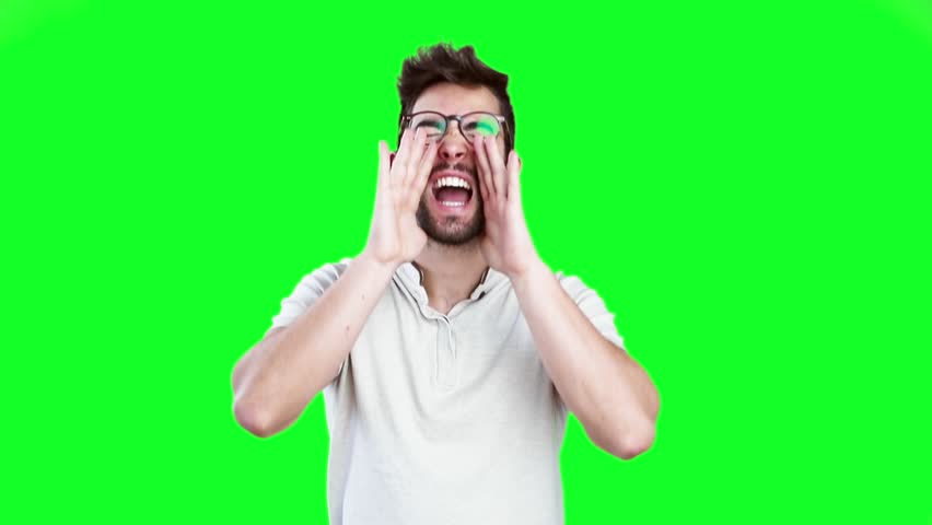 young man shouting on green screen Royalty-Free Stock Footage #21308047
