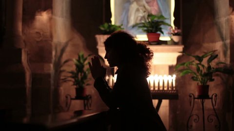 Woman praying in church