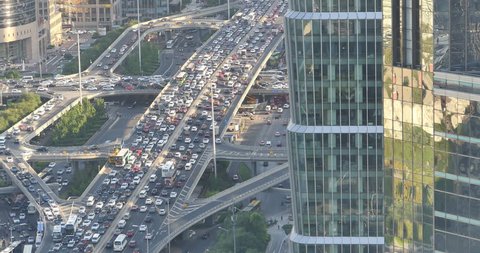 4k,timelapse,heavy traffic through BeiJing central business district that is located in the Chaoyang district,the main hub for financial and business activities in China's capital city. gh2_11847_4k