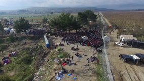Aerial video shows thousands of asylum seekers on the Greece-Macedonia border near the town of Idomeni waiting to cross the frontier - Idomeni, Greece, 5 December 2015.