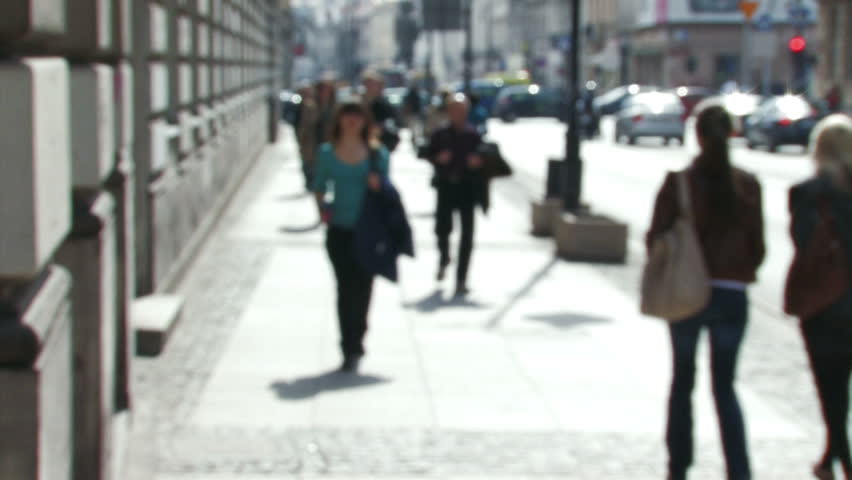 De-focused people walk in slow motion 5