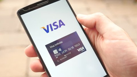MONTREAL, CANADA - November 2016 : Credit Card payment companies logo being swipe on smartphone screen : Mastercard, Visa, American Express, Discover

Great concept for ecommerce shopping.