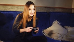 Beautiful girl plays in computer games