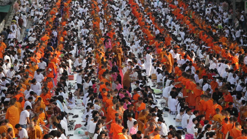 BANGKOK - MARCH 25: Monks are participating in a Mass Alms Giving of 12,600
