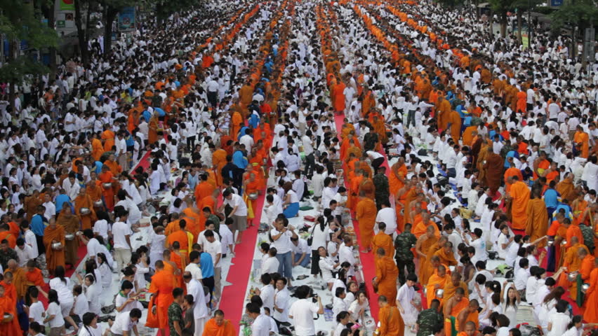 BANGKOK - MARCH 25: Monks are participating in a Mass Alms Giving of 12,600