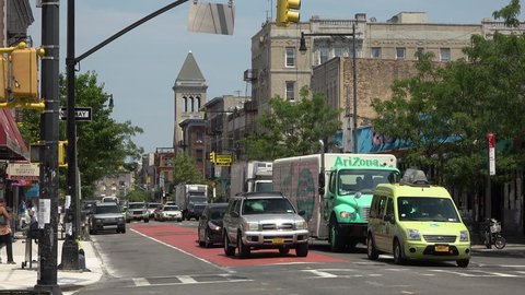 BROOKYLN, NY - CIRCA JULY 2016 - Traffic on Nostrand Avenue in the rapidly gentrifying neighborhood of Crown Heights, Brooklyn circa July 2016.