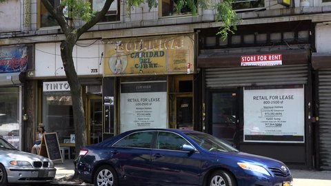 BROOKYLN, NY - CIRCA JULY 2016 - Commercial real estate company advertises vacant spaces along Nostrand Avenue in Crown Heights, Brooklyn circa July 2016. 