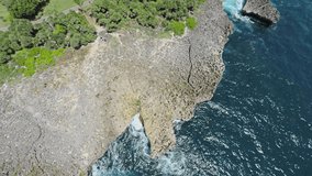 Aerail shot of the Nusa Dua peninsula island and waterblow hole area with its sharp rocks coast, camera facing down
