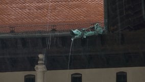 Heavy raining at the medieval castle, and waters flows through gutter. - Powered by Shutterstock - Get 15% off with code: PIKWIZARD15