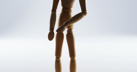 Conceptual image of figurine standing on white background