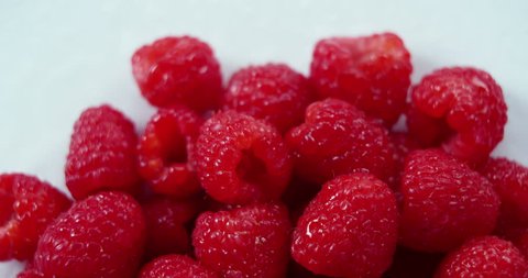 Close-up of fresh raspberries against white background