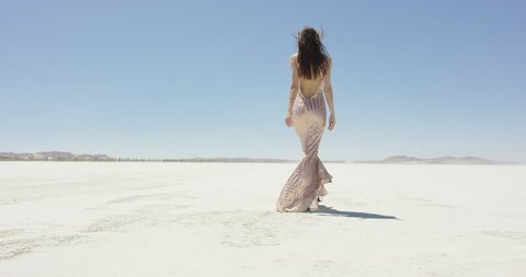 Girl walking in the desert