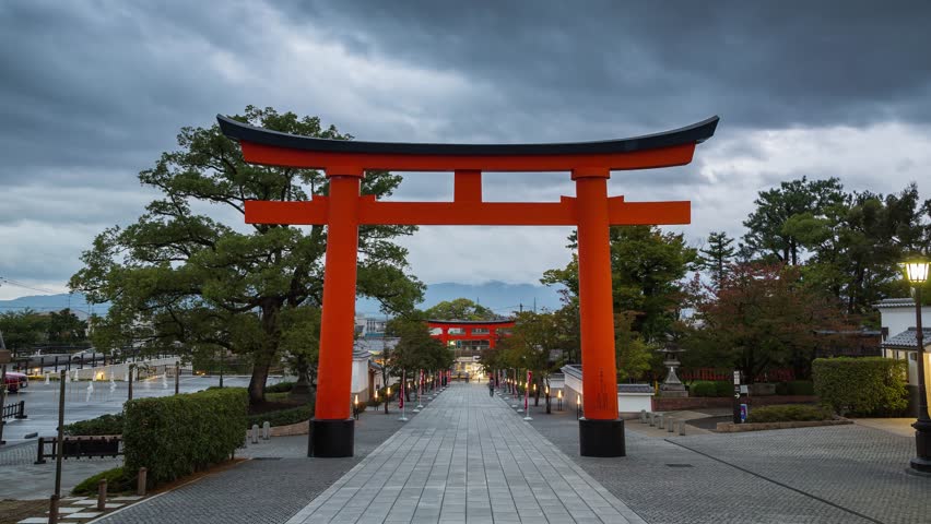 Red Torii gates of Fushimi Inari Shrine, Kyoto, Kansai Prefecture, Honshu, Japan. Time Lapse 4K