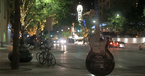 AUSTIN, TEXAS, CIRCA MARCH 2015 - Electric Guitar statue on Congress Avenue Austin, Texas. Paramount theatre is in the background